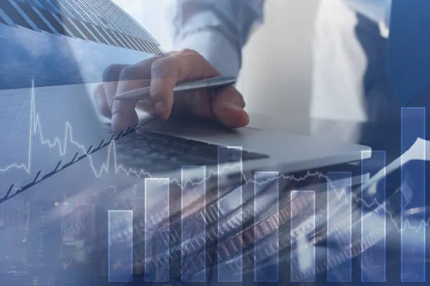 Investor analyzing market data and financial charts to guide modern wealth navigation